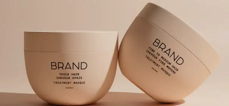 Labeled hair treatment masque containers for thick and medium hair by MISTURA.