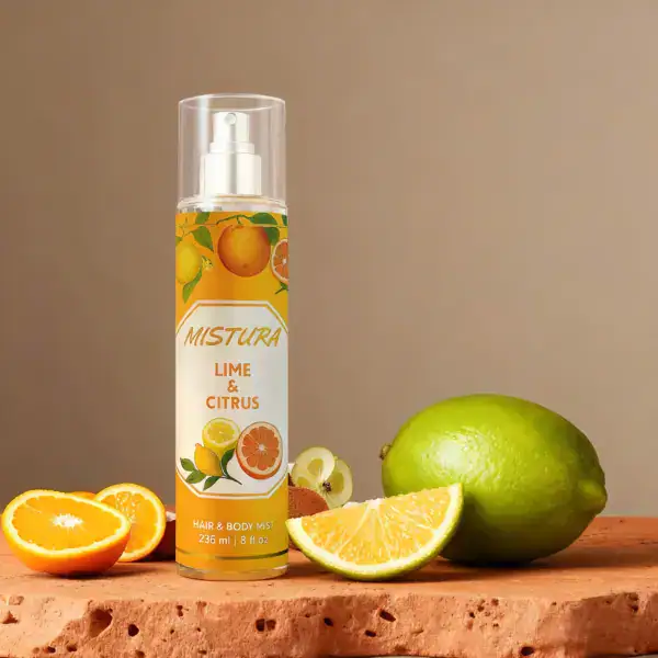 MISTURA Lime Citrus Body Mist 236mL with woman applying natural vegan energizing fresh fragrance spray