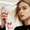 Strawberry chocolate body mist, girl spraying MISTURA Hair & Body Mist for fresh scent.